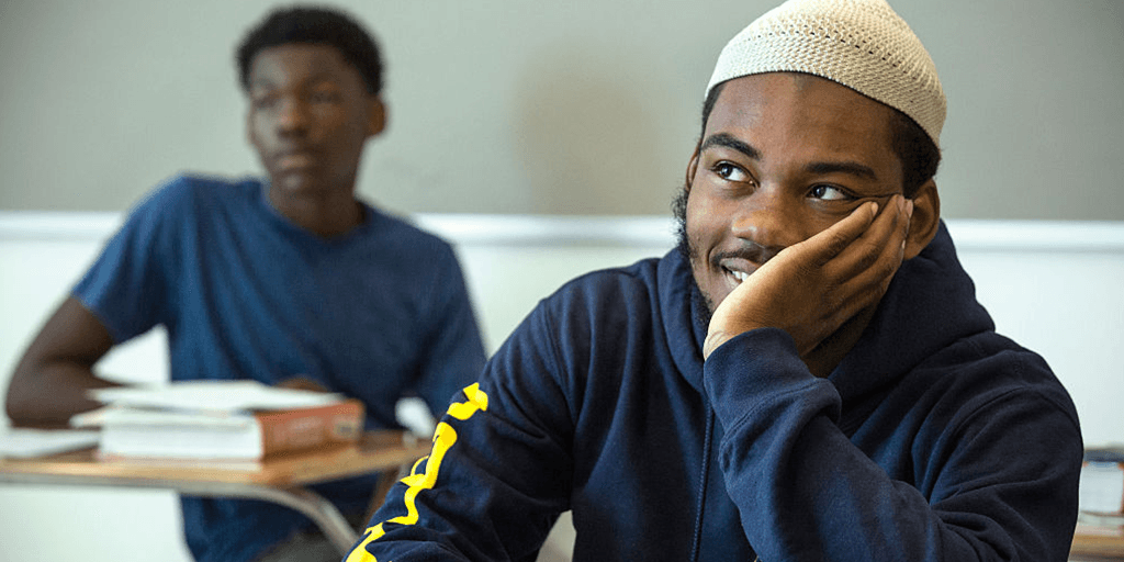 two students sit in a classroom