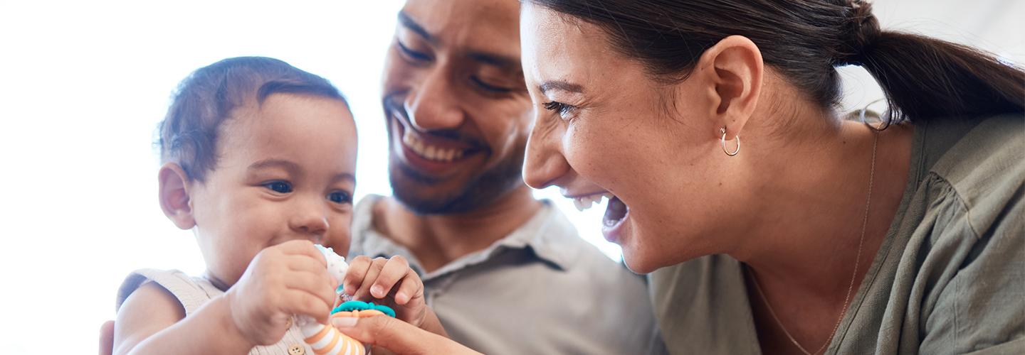 parents hold their child