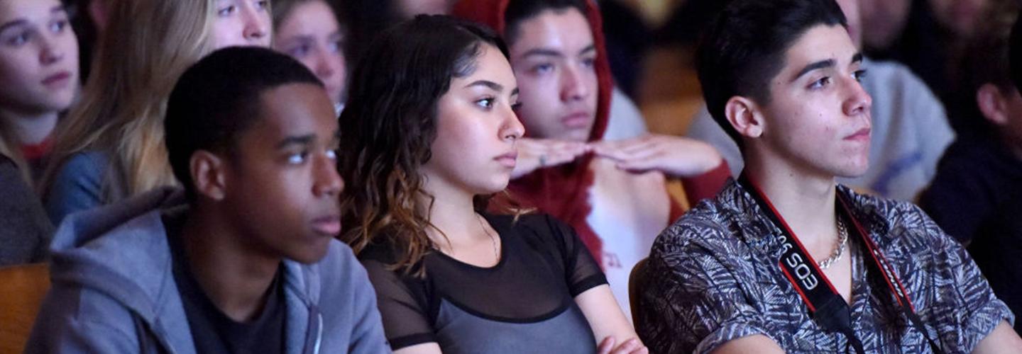 students listen to a discussion on mental health