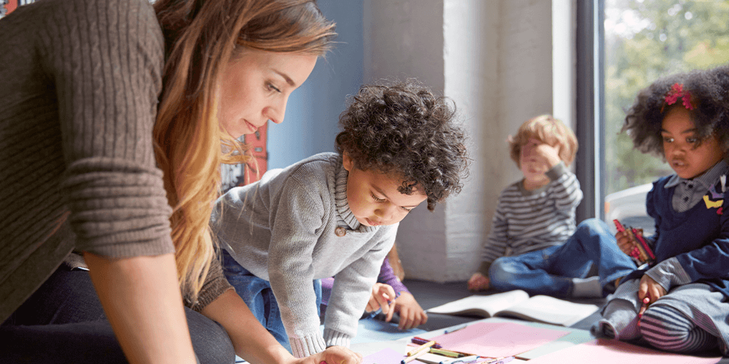 woman with children in daycare setting